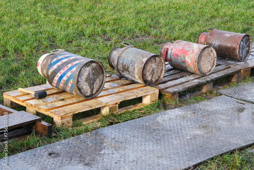 Photos Old milk cans lying in a row