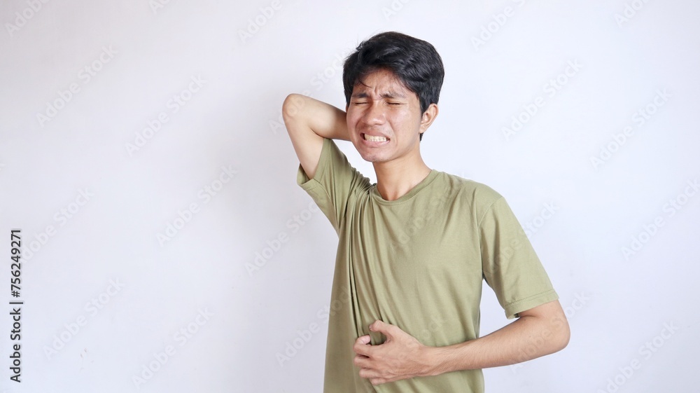 Asian man gesturing with itchy pain all over his body Asian man gesturing with itchy pain all over his body