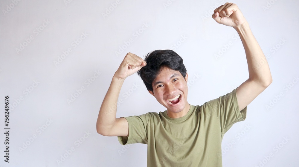 close-up of young handsome Asian man excited and happy close-up of young handsome Asian man excited and happy