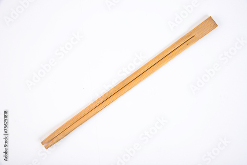 Wooden chopsticks on a white background. Copy space.