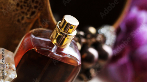 A bottle of elite perfume in a glass bottle. Brown color.