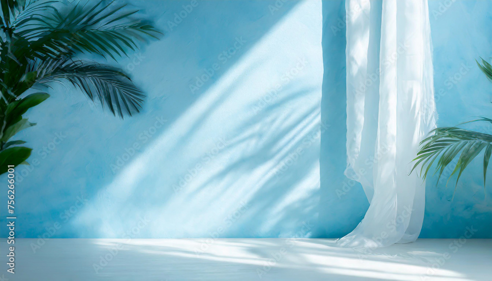Blurred shadow from palm leaves on the light blue wall. Minimal abstract background for product presentation. Spring and summer. Blurred shadow from palm leaves on the light blue wall. Minimal abstract background for product presentation. Spring and summer.