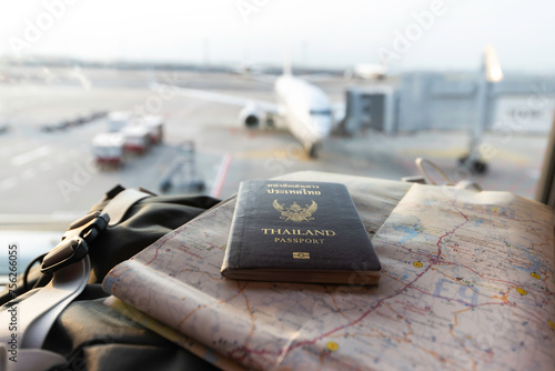 Travel planning concept, Hand holding Passport and Airline tickets with Airplane . Travel Concept photo