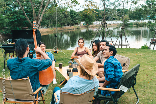 A group of people are sitti...