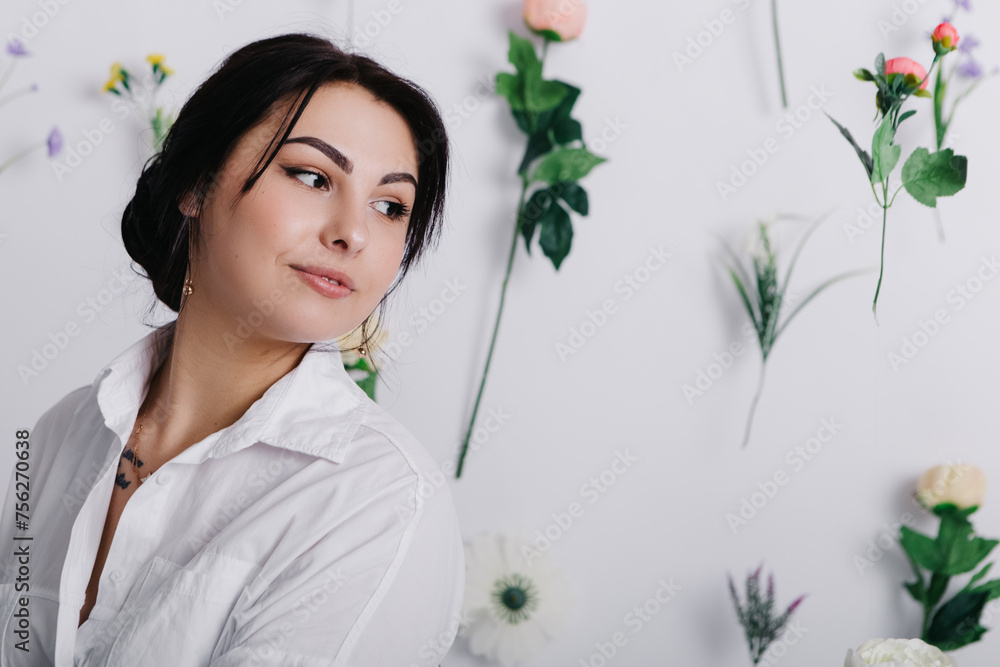 Beautiful pretty woman poses near flowers hanging in air. Lady dressed jeans and white shirt. Spring International Women`s Day, 8th of March. Holiday, festive, celebration
Beautiful pretty woman poses near flowers hanging in air. Lady dressed jeans and white shirt. Spring International Women`s Day, 8th of March. Holiday, festive, celebration