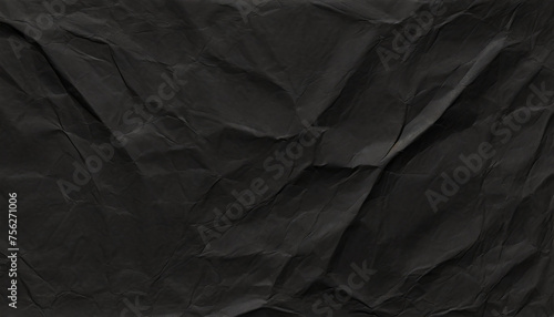Black crumpled paper texture, damaged wrinkled paper. Abstract textured rumpled page background