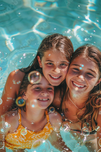 close-up of happy mother and daughter in pool