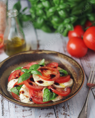 A bowl with traditional Italian caprese salad 