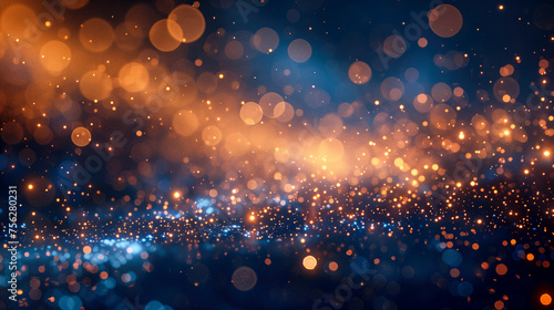background with specs of gold and shiny bokeh stars on a windy blue surface photo