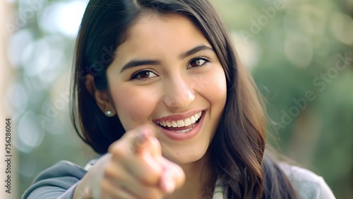 Close-up Portrait  Smiling Young Woman in Pointing Pose