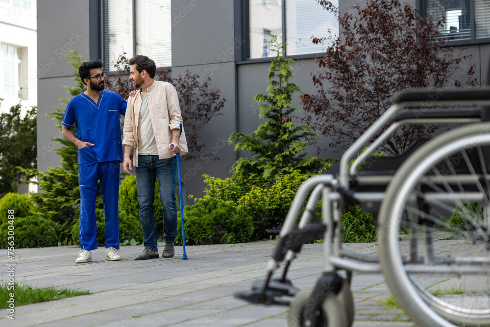 Male nurse having a walk with a patient in a rehabilitation center Male nurse having a walk with a patient in a rehabilitation center