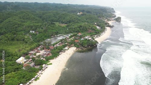 4k Video Footage - Aerial view of Sundak beach in Gunungkidul, Yogyakarta, Indonesia with crashing waves during the day. photo