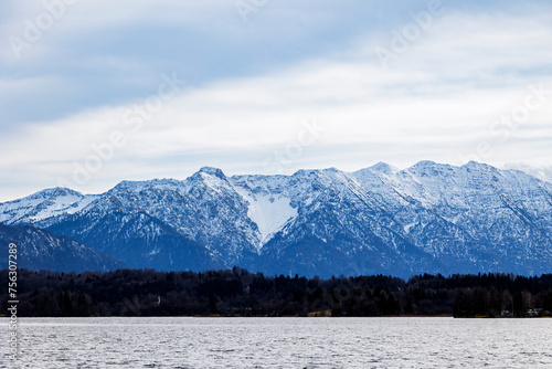 View over the Staffelsee and the island of Wörth with the St Simpert chapel to the Kochel mountains in the Alps