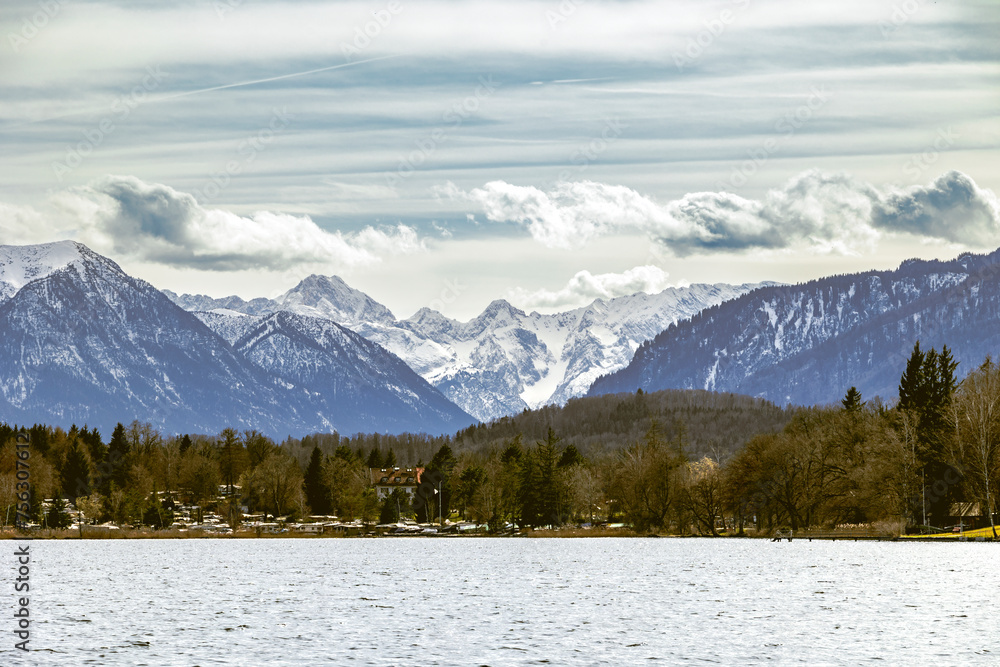 View over the Staffelsee in Bavaria from Uffing to the opposite shore and the Kochel mountains in the Alps