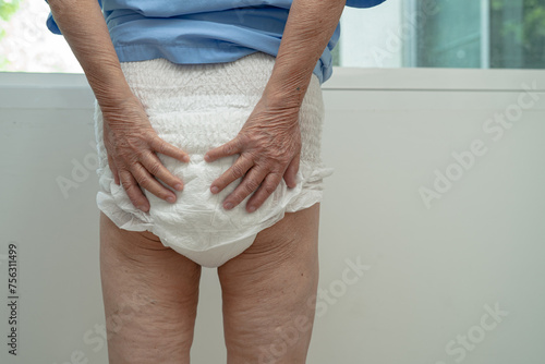 Asian senior woman patient wearing incontinence diaper in hospital, healthy strong medical. photo