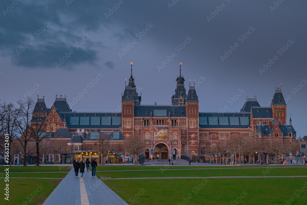 Netherlands, March 28 2023: Amsterdam at summer night. Famous national Rijks museum general view at dusk