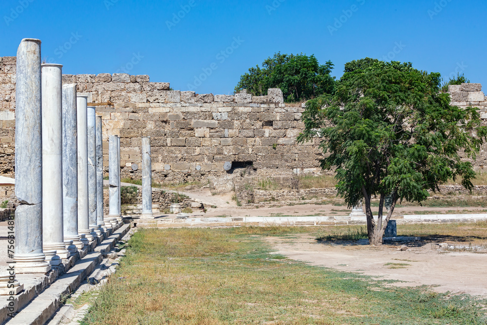 Side Agora modern restauration. Row of marble columns stands at Side's ancient agora, under a clear sky. Side, Antalya, Turkey (Turkiye)