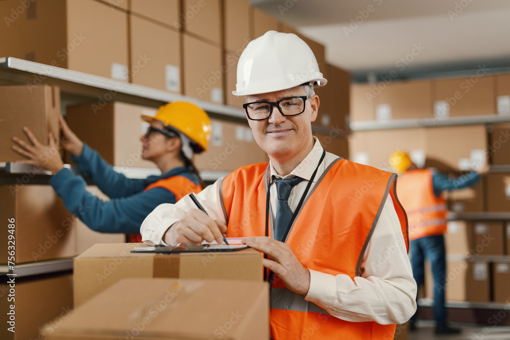 Warehouse manager checking documents and orders Warehouse manager checking documents and orders