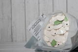 Bouquet of marshmallow dumplings. Marshmallow dumplings. Homemade marshmallows. on a wooden background. Place for text.