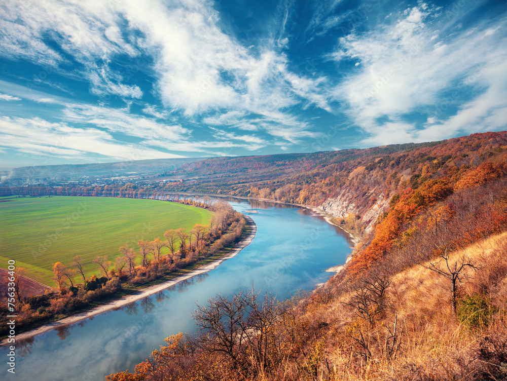 Rural landscape. River with a rocky bank in autumn. Beautiful nature