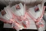 Three wedding bouquets in pink and white wrapping paper. Top view