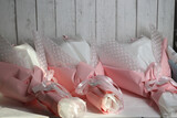 Three wedding bouquets in pink and white wrapping paper.