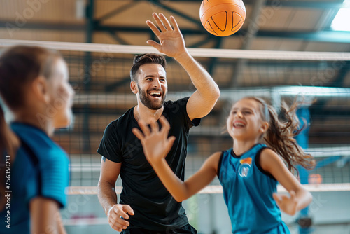 Kids Play Training Game With Coach During Volleyball Practice. Young Coach Coaching Children at Physical Education Class photo