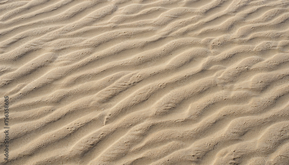 closeup of sand pattern of a beach in the summer with ripple marks; vertical image closeup of sand pattern of a beach in the summer with ripple marks; vertical image