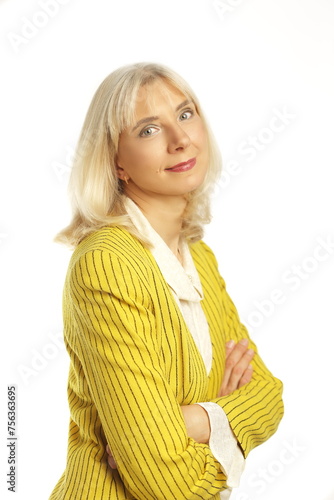blond woman in her 50s posing