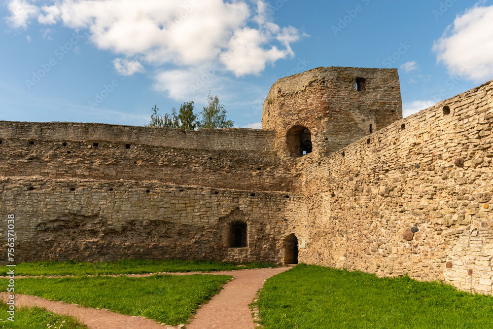 Izborsk, Russia, September 7, 2023. Corner of the fortress wall with a watchtower.