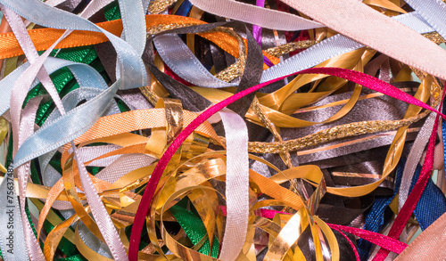 Background tangled with colorful ribbons.