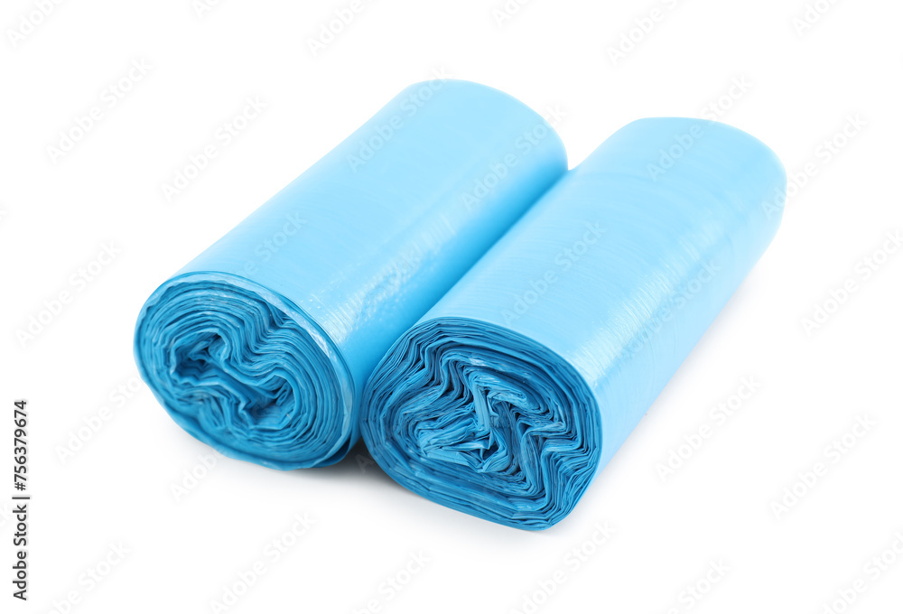Two rolls of light blue garbage bags isolated on white Two rolls of light blue garbage bags isolated on white