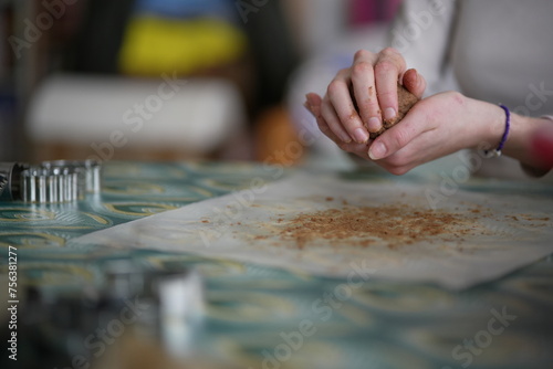 Woman preparing biscuits on the table