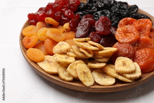 Delicious dried fruits on white table, closeup