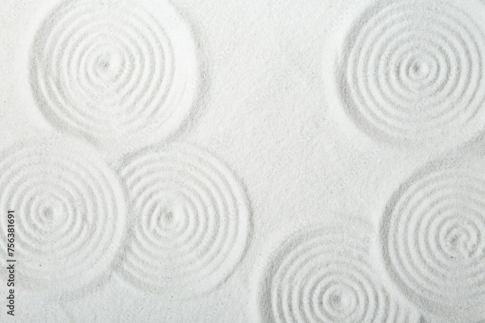 Zen rock garden. Circle patterns on white sand, top view Zen rock garden. Circle patterns on white sand, top view