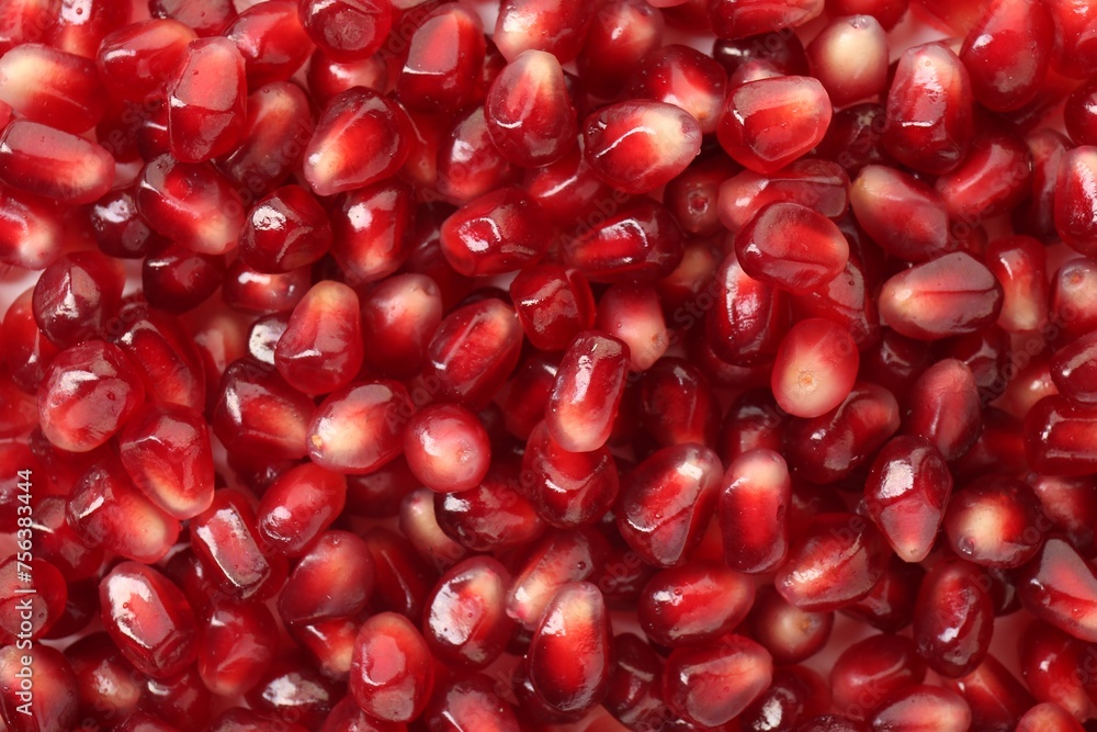 Ripe juicy pomegranate grains as background, top view Ripe juicy pomegranate grains as background, top view
