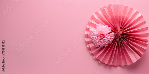 Pink paper umbrellas on a pink background  Top view of beautiful roses    