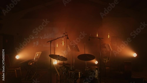 Hazy empty stage lit by hanging edison bulbs. photo