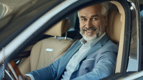 Affluent, smiling man driving a luxury car, embodying success and comfort.