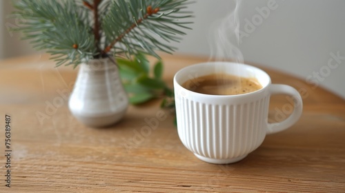 Elegant and simple white ceramic coffee cup with saucer on wooden table