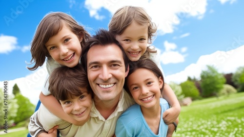 Happy family of five in the park