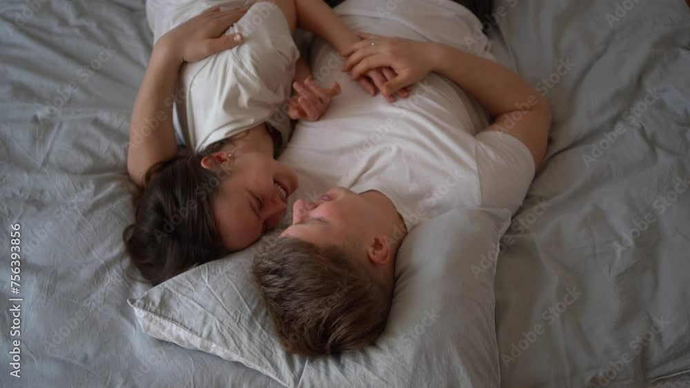 a young couple, a man hugs a woman tightly a young couple, a man hugs a woman tightly