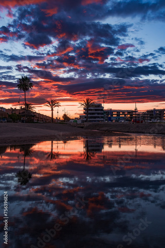 Stunning sunset reflection over tranquil water © Rafael