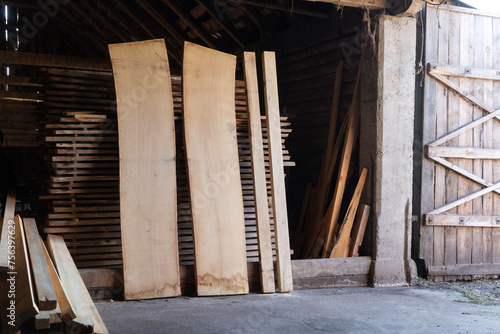 Long cut oak boards in carpentry workshop