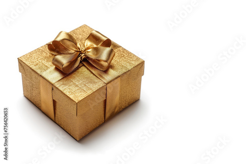 Gift box in gold craft wrapping paper and gold satin ribbon on white background.