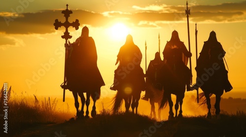 Knights Templar on horseback silhouetted against the sunset in relentless pursuit of the Holy Grail photo