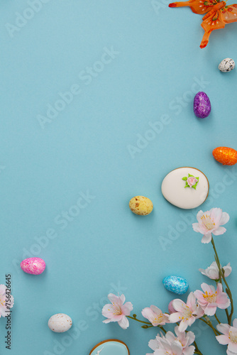 Festive blue Easter holiday background with decorations eggd and cookies