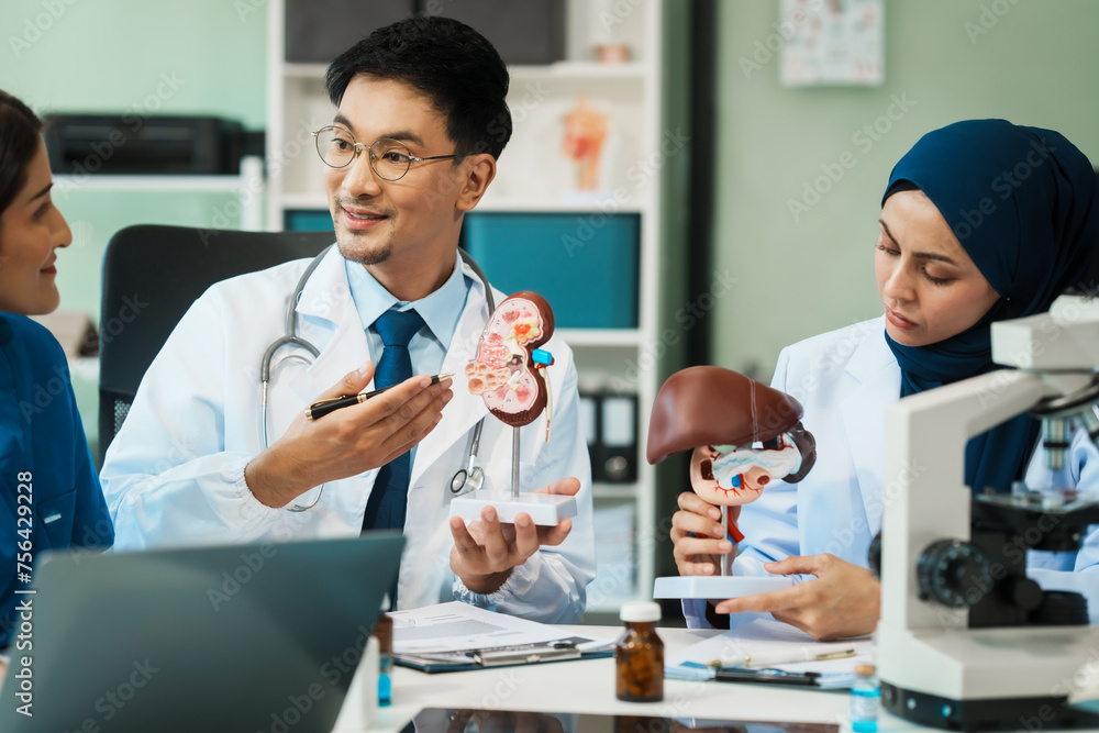 Obraz premium A diverse group of healthcare professionals, including doctors, nurses, and specialists, engaging in a collaborative meeting to discuss medical cases and share expertise in a hospital