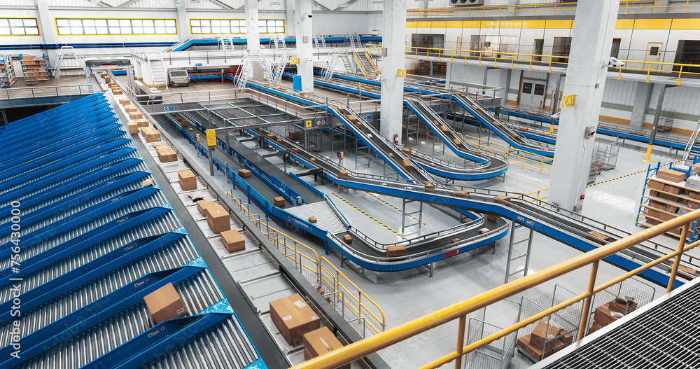 Modern Delivery Logistics Warehouse with Working Automated Conveyor Belt with Retail Parcels, Cardboard Boxes and Online Shopping Orders Being Prepared for Shipping