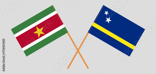 Crossed flags of Suriname and Country of Curacao. Official colors. Correct proportion